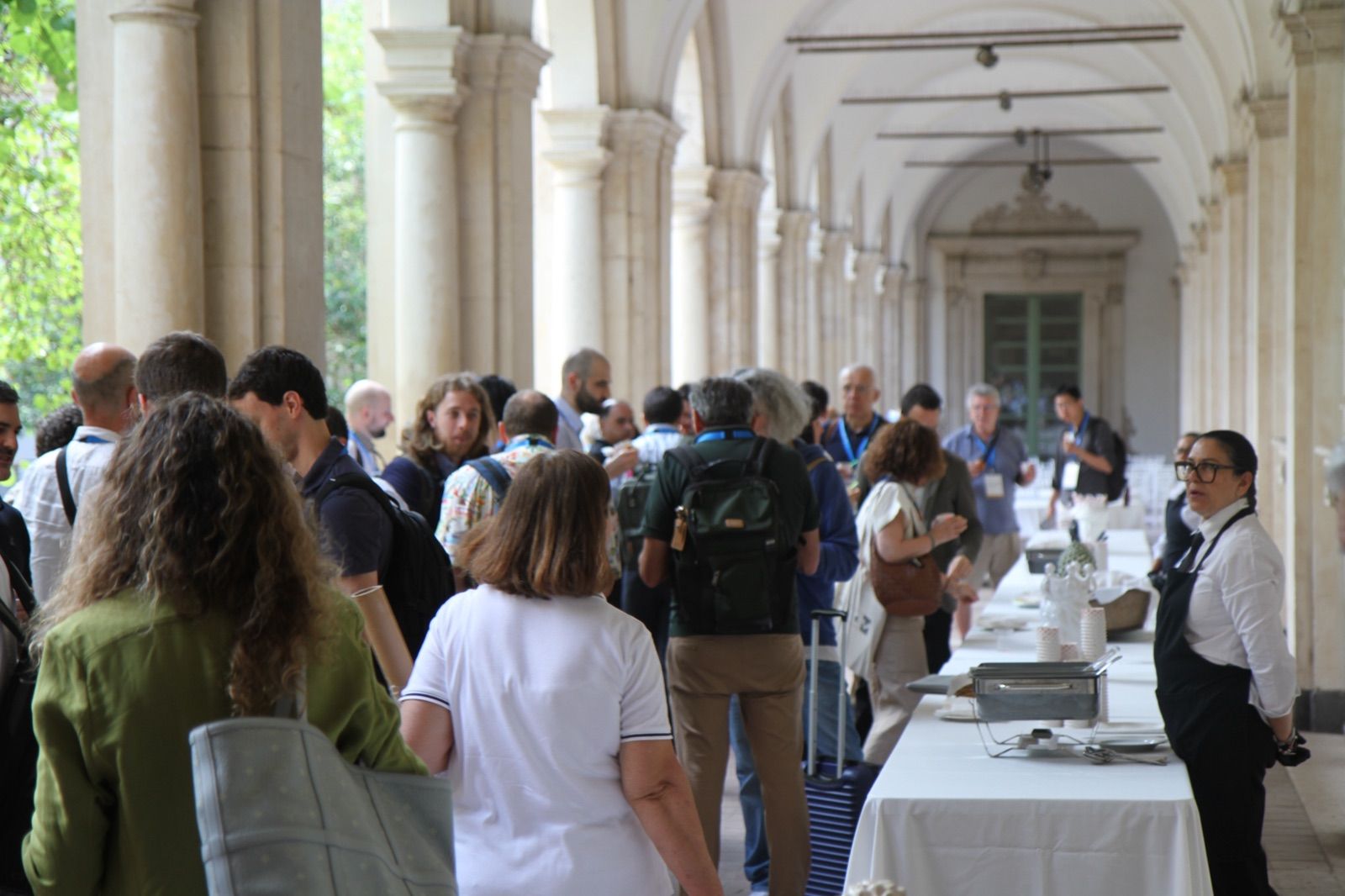 Coffee break in the cloister at AES 2026, Catania